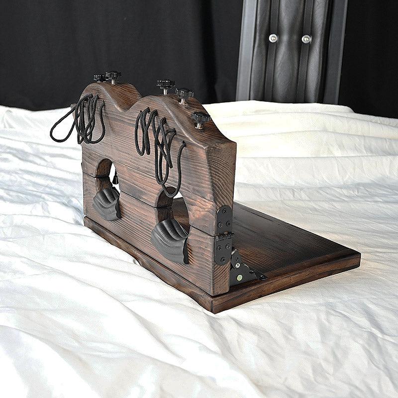 THORN GARDEN™ foot-tickling wooden pillory