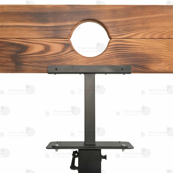 Close-up of burnt-wood finish pillory top with neck and wrist openings and integrated lock