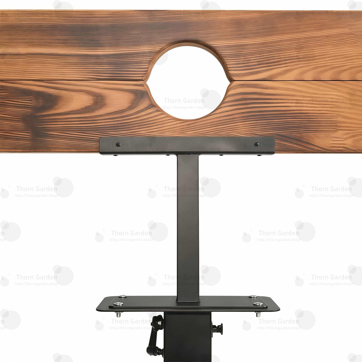 Close-up of burnt-wood finish pillory top with neck and wrist openings and integrated lock