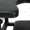 Close-up of premium black padded leather seat showing keyhole cutout design and heavy-duty stitching