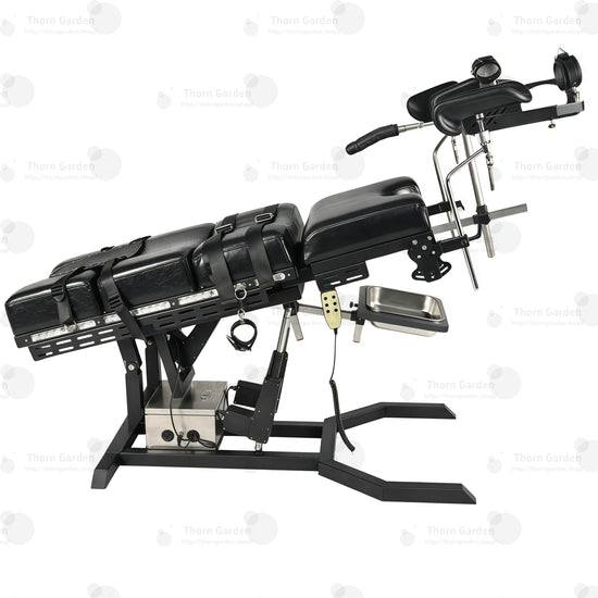 Close-up of electric lift actuator mechanism, control box, and handheld remote controller on gyno examination bondage chair