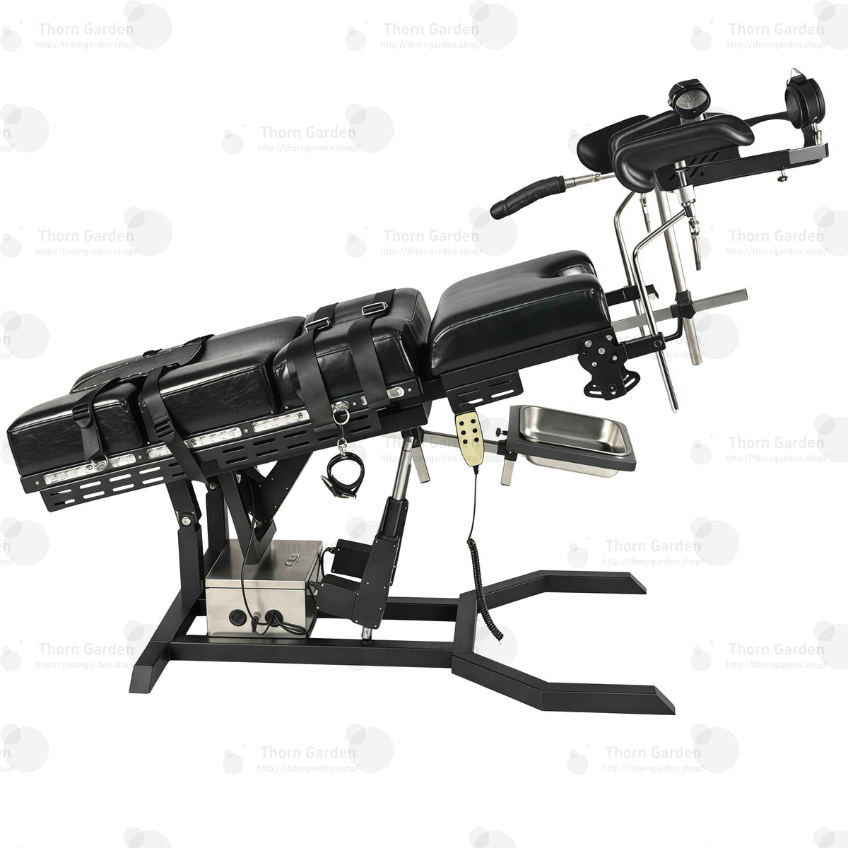 Close-up of electric lift actuator mechanism, control box, and handheld remote controller on gyno examination bondage chair