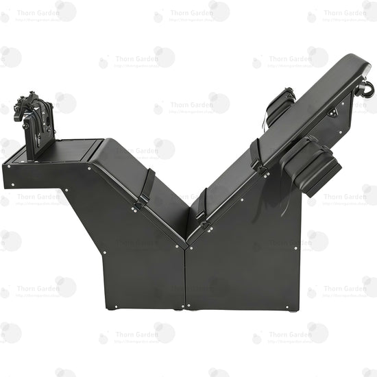 Black heavy-duty tickling chair with steel frame and adjustable leather restraint panels