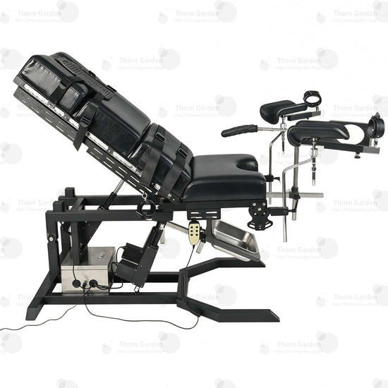 Close-up of electric lift actuator mechanism, control box, and handheld remote controller on gyno examination bondage chair