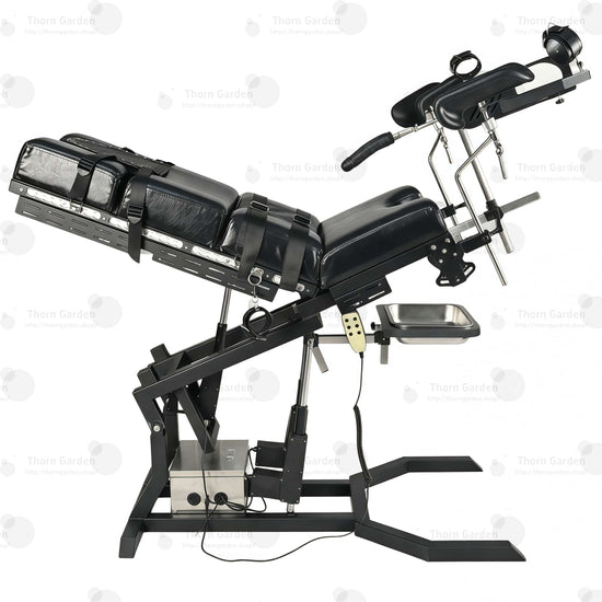 Close-up of electric lift actuator mechanism, control box, and handheld remote controller on gyno examination bondage chair