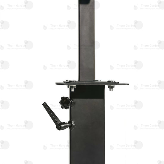 Detail of black steel central post with mounted accessory tray and support bracket