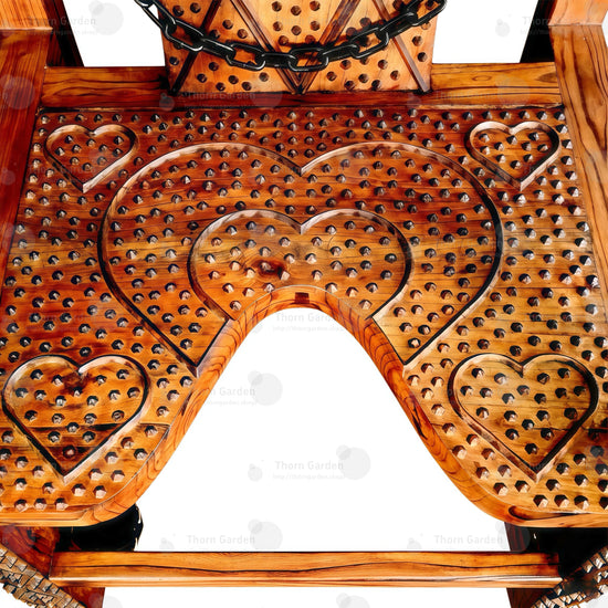 Interior view of U-shaped open-front wooden seat plate and ankle restraint cuffs on bottom chair legs