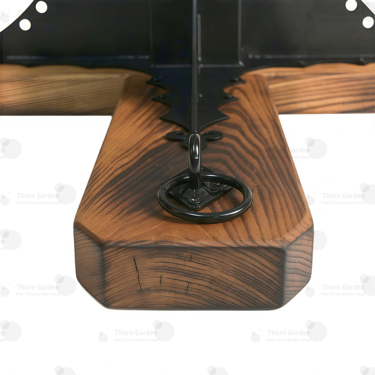 Detail of heavy-duty steel tie-down loops mounted on solid wood base arms
