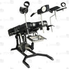 Side profile of electric gyno bondage chair with motorized height adjustment, leather padded cushions, restraint straps, and leg supports