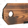 Close-up of burnt-wood finish pillory top with neck and wrist openings and integrated lock