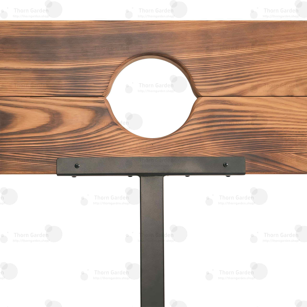 Close-up of burnt-wood finish pillory top with neck and wrist openings and integrated lock