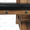 Close-up of side bench leather cushion edge showing brass rivets and black metal O-ring anchors