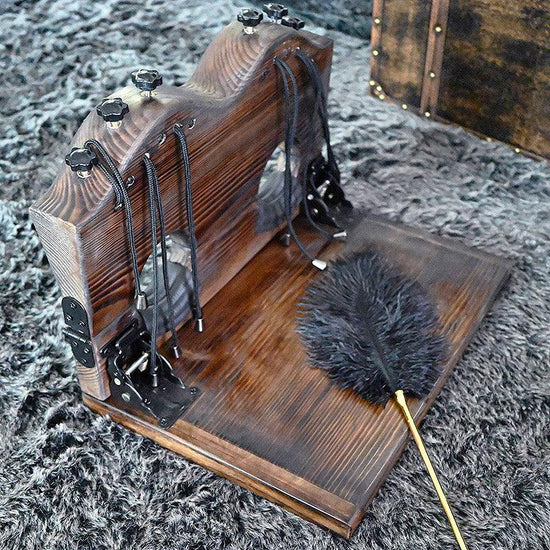 THORN GARDEN™ foot-tickling wooden pillory