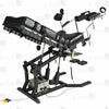 Close-up of electric lift actuator mechanism, control box, and handheld remote controller on gyno examination bondage chair