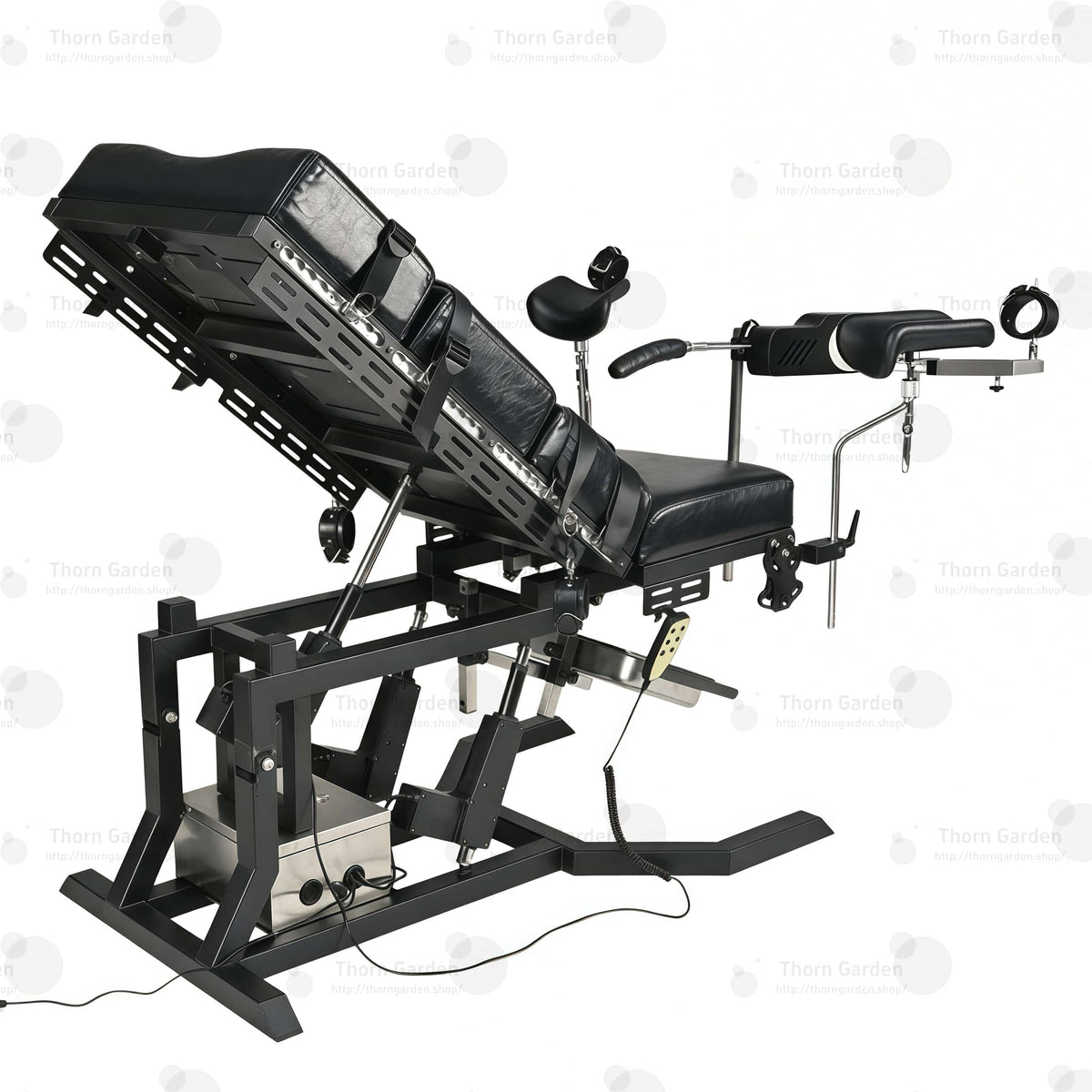 Close-up of electric lift actuator mechanism, control box, and handheld remote controller on gyno examination bondage chair