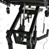 Close-up of electric lift actuator mechanism, control box, and handheld remote controller on gyno examination bondage chair