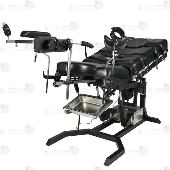 View of removable stainless steel utility tray and heavy-duty steel base frame on electric bondage table
