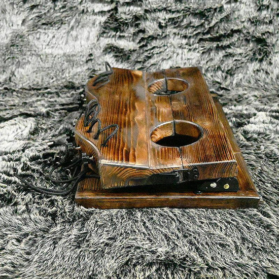 THORN GARDEN™ foot-tickling wooden pillory