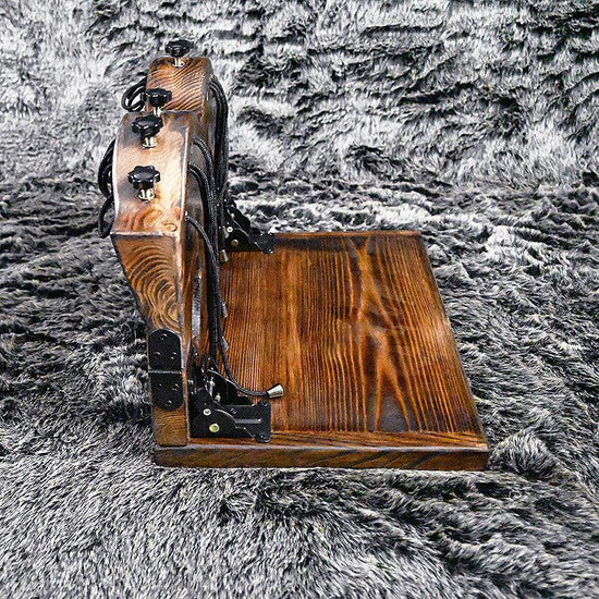 THORN GARDEN™ foot-tickling wooden pillory