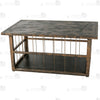 Close-up of distressed antique bronze tabletop finish and adjustable leveling feet on TG062 coffee table cage