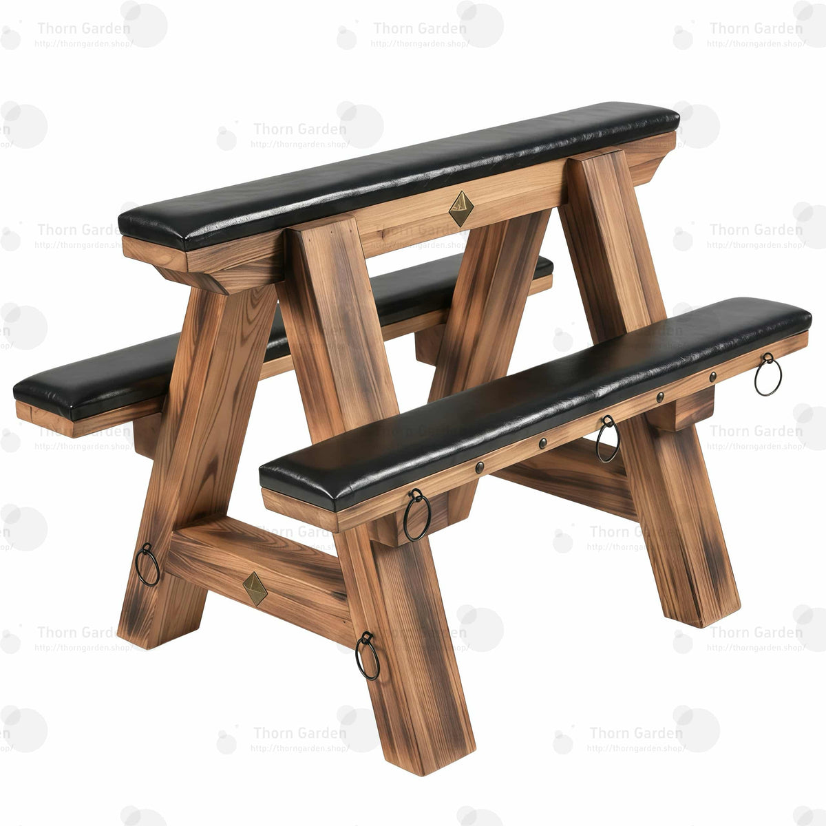 Three-quarter view of solid wood bondage horse bench with black leather padded cushions, torched wood finish, and metal anchor rings