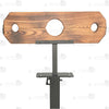 Close-up of burnt-wood finish pillory top with neck and wrist openings and integrated lock