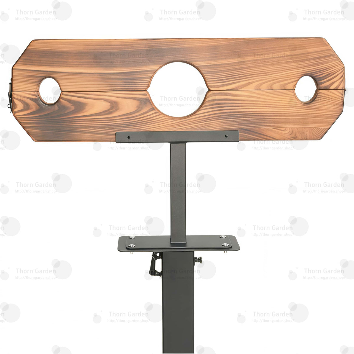 Close-up of burnt-wood finish pillory top with neck and wrist openings and integrated lock