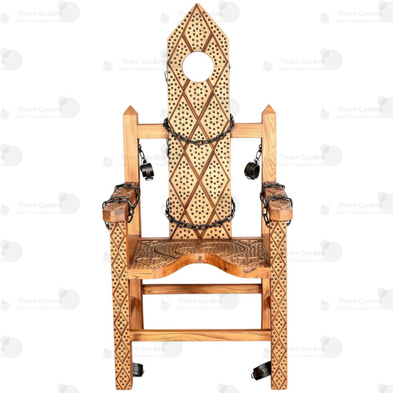 Full view of solid wood torture bondage armchair with hand-carved spiked texture, neck hole, chains, and restraints