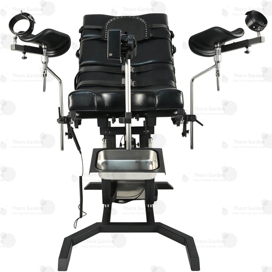 View of removable stainless steel utility tray and heavy-duty steel base frame on electric bondage table