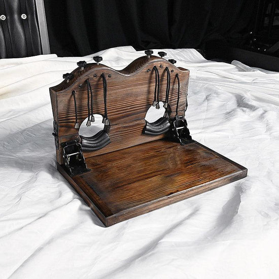 THORN GARDEN™ foot-tickling wooden pillory