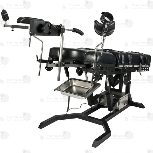 View of removable stainless steel utility tray and heavy-duty steel base frame on electric bondage table