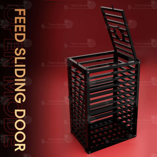 Product detail view of the THORN GARDEN Heavy Duty BDSM Bondage Cage - TGQL highlighting the heavy-duty all-metal steel construction, matte black finish, and sliding front feed door mechanism with vertical text overlay reading FEED SLIDING DOOR