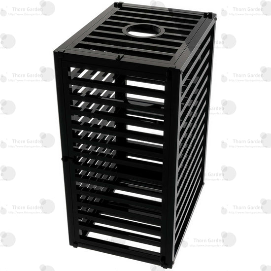 Product angle view of the THORN GARDEN Heavy Duty BDSM Bondage Cage - TGQL highlighting the heavy-duty all-metal steel construction, matte black finish, and closely spaced bar design from an elevated perspective