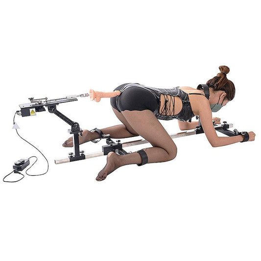 Studio product model action view of the THORN GARDEN 3G Bondage Stockade with metalcuffs showcasing a model secured in a four-limb doggy style restraint rack with an electric sex machine against a clean background