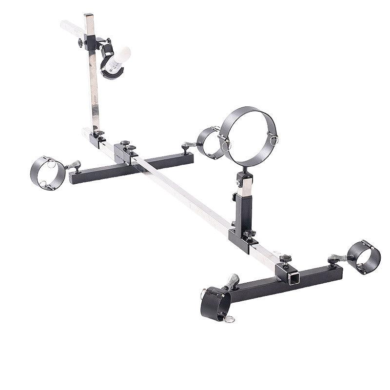Studio product axometric overview view of the THORN GARDEN 3G Bondage Stockade with metalcuffs showcasing the heavy-duty four-limb restraint frame with machine mount against a clean white background