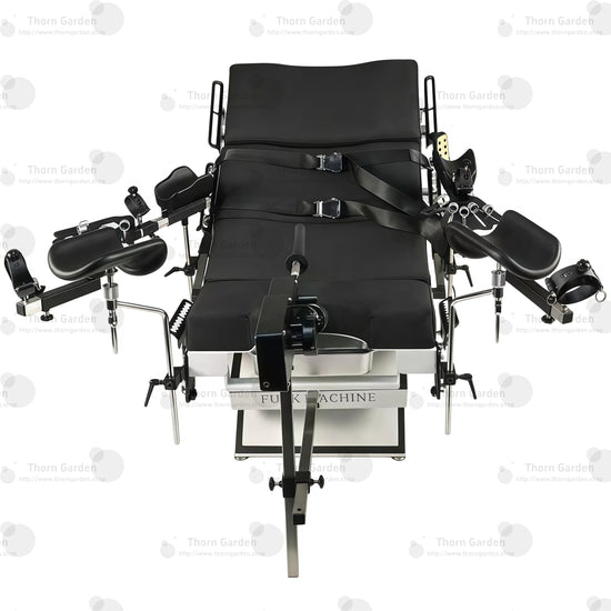 Studio product front overview view of the THORN GARDEN Electric Gyno Bondage Chair Custom showcasing the electric sex machine, gynecological stirrups, and heavy-duty frame structure against a clean white background