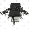 Studio product front overview view of the THORN GARDEN Electric Gyno Bondage Chair Custom showcasing the electric sex machine, gynecological stirrups, and heavy-duty frame structure against a clean white background