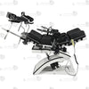 Studio product top overview view of the THORN GARDEN Electric Gyno Bondage Chair Custom showcasing the complete upper restraints, gynecological stirrups, and remote controller against a clean white background